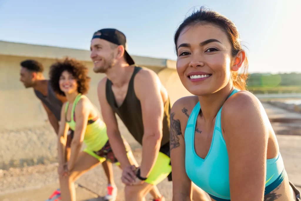 close up of a smiling sporty woman doing sports utc